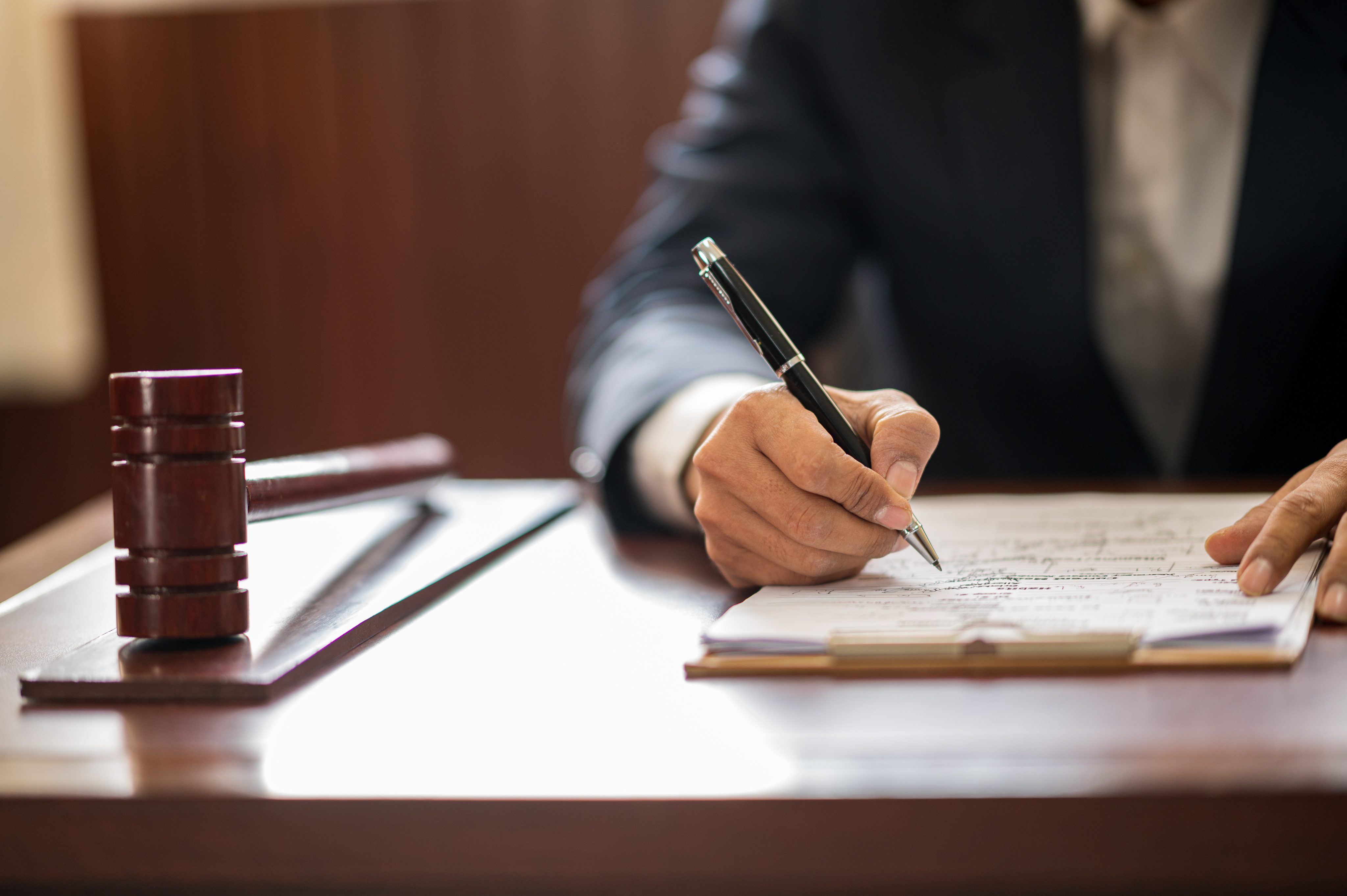 Legal professional reviewing and signing documents
