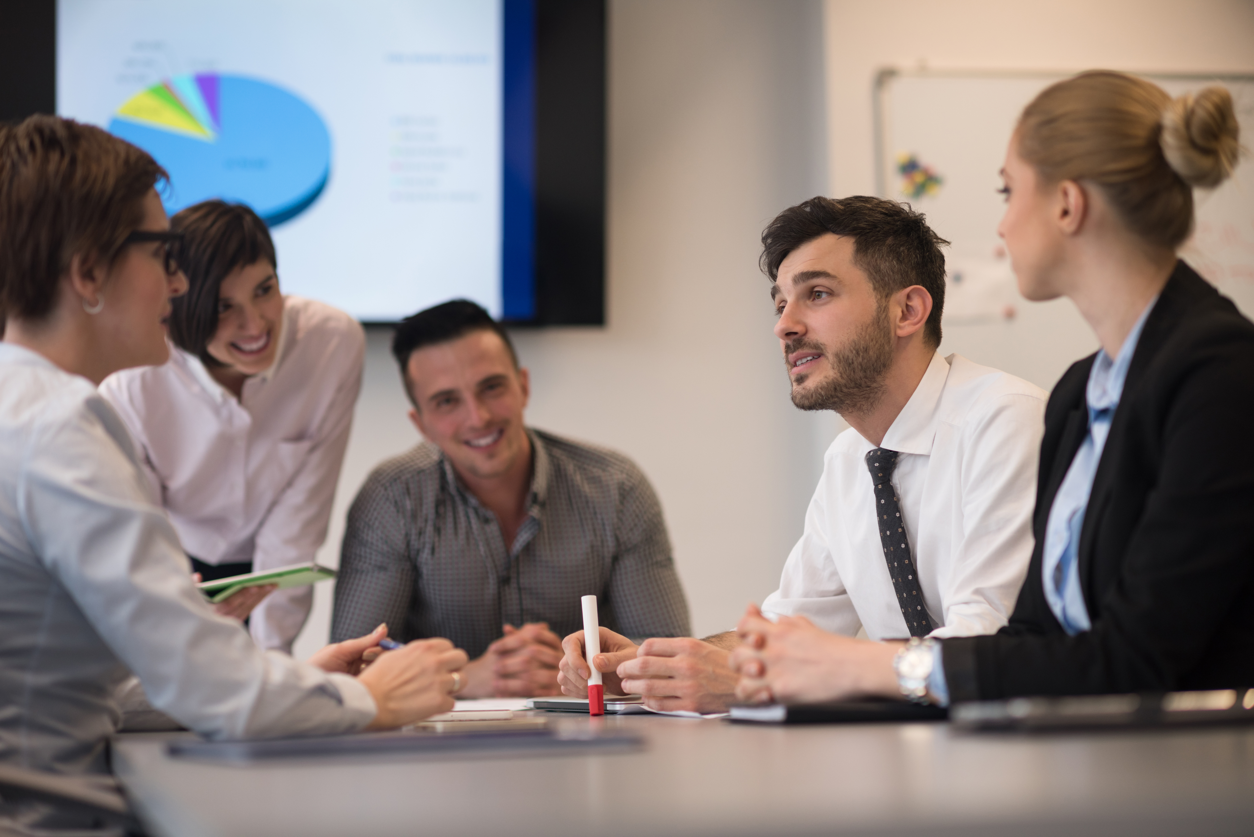 Business leaders collaborating around a table
